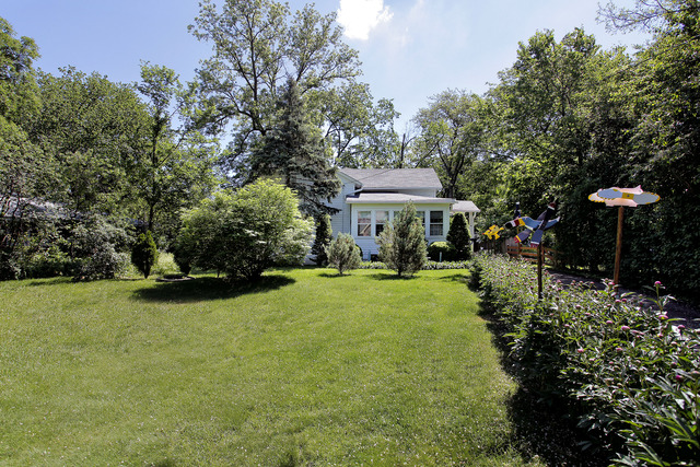 1129 Shermer Road Glenview, IL 60025 - Photo 2 of 3 a view of a chair and table on the garden