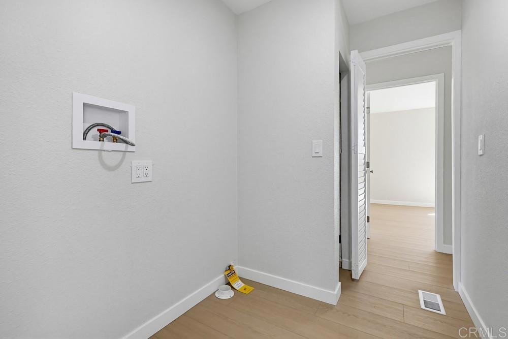 2400 Alpine Boulevard, Unit 8 Alpine, CA 91901 - Photo 12 of 19 a view of storage and utility room with wooden floor
