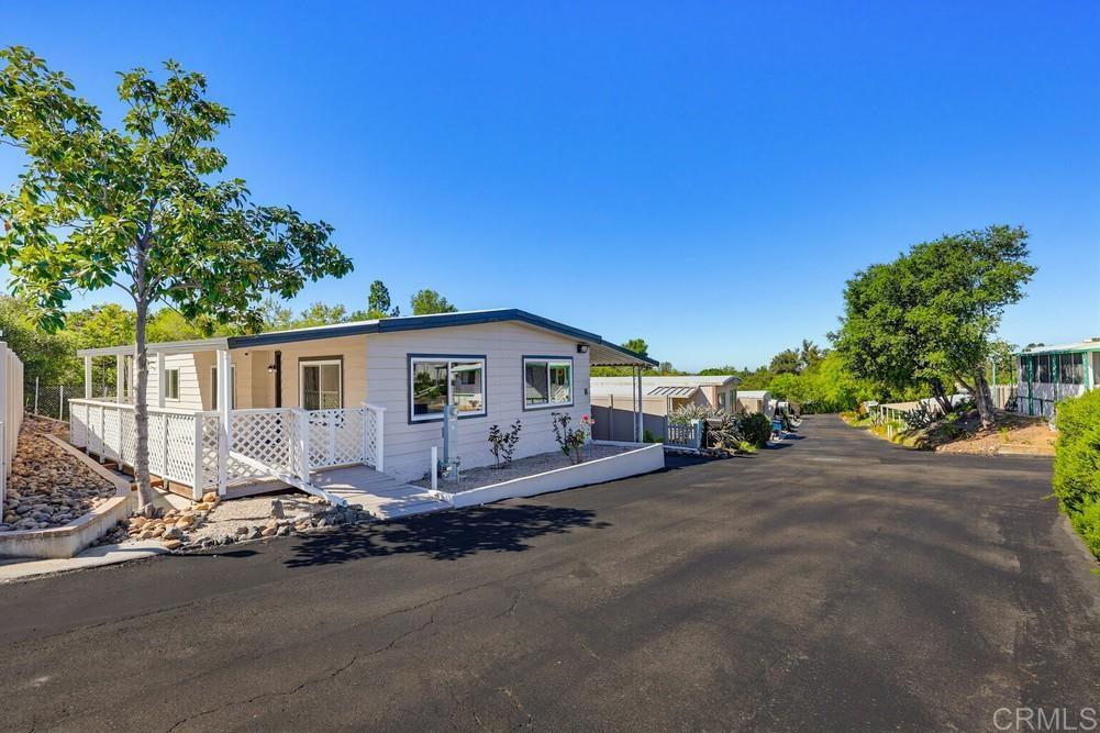 2400 Alpine Boulevard, Unit 8 Alpine, CA 91901 - Photo 2 of 19 a view of a house with backyard and a tree