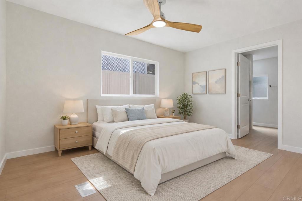 2400 Alpine Boulevard, Unit 8 Alpine, CA 91901 - Photo 7 of 19 a bedroom with a bed and a chandelier