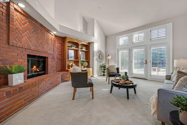 a bedroom with bed couch and window