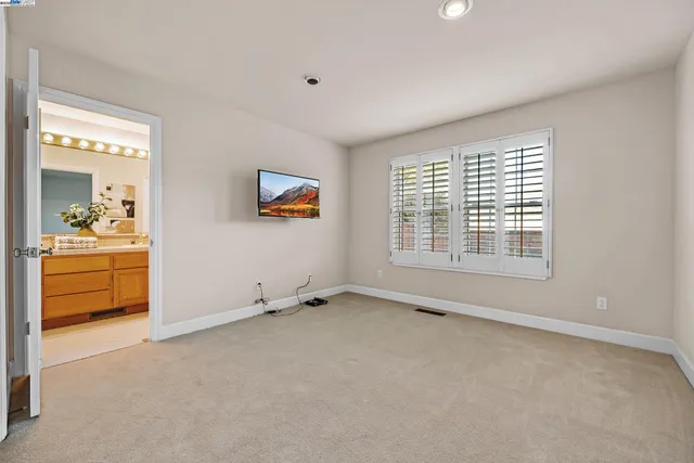 a living room with furniture and flowers
