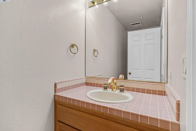 a view of a room with cabinet and windows