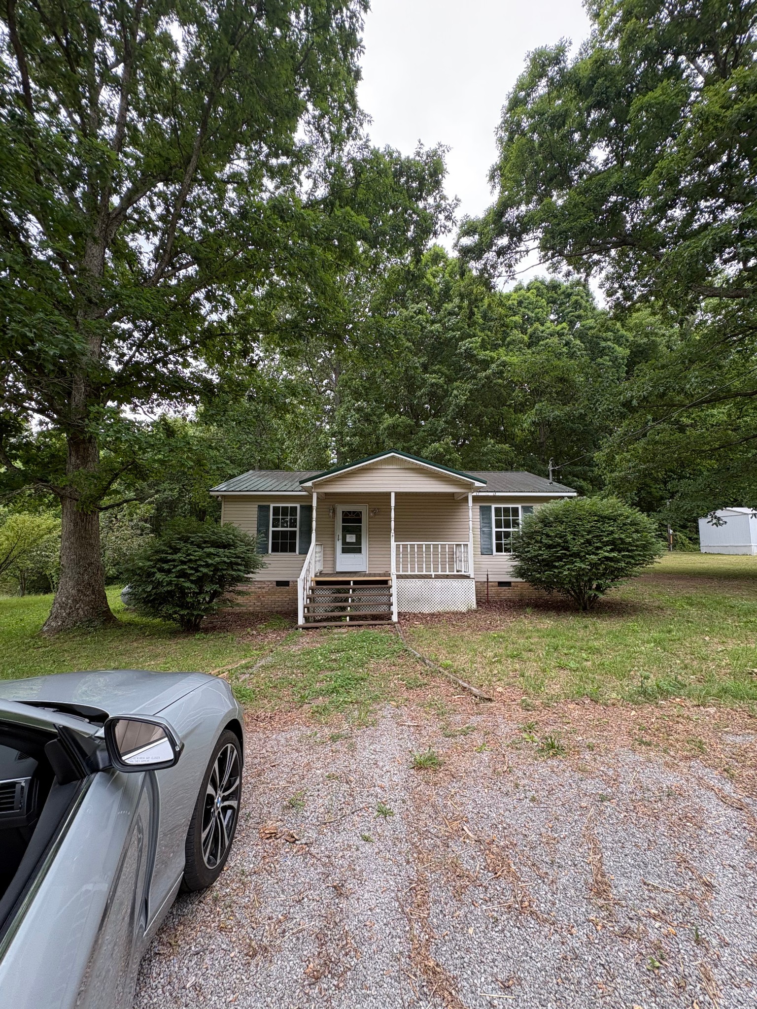 2174 Pleasant Hill Road Lynchburg, TN 37352 - Photo 1 of 16 a front view of a house with garden