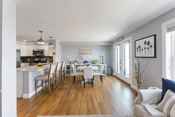 a view of a dining room with furniture window and wooden floor