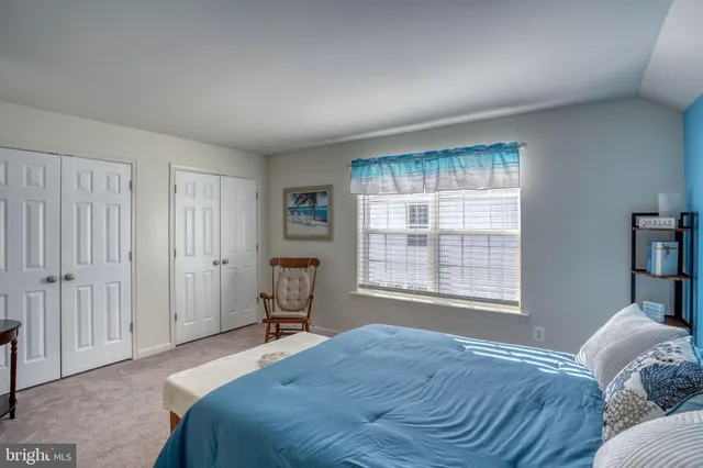 a work room with furniture and a flat screen tv