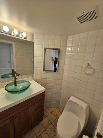 a bathroom with a shower and toilet
