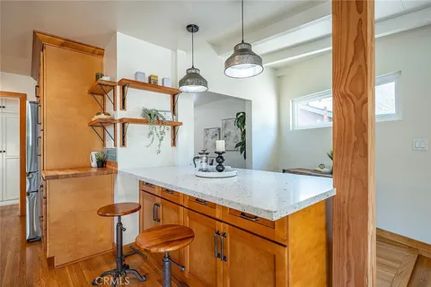 a view of dining room with furniture and a chandelier
