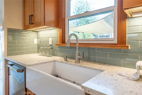 a view of a sink and a window