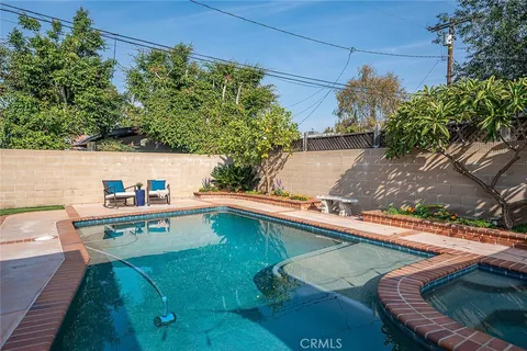 a view of a swimming pool with a patio