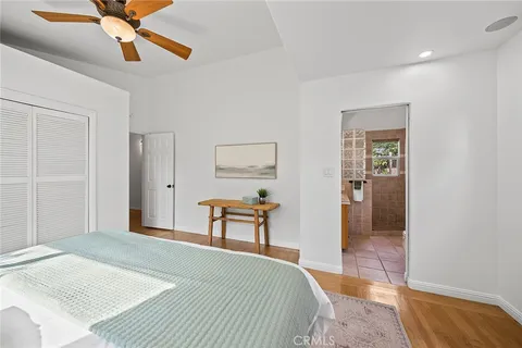 a bedroom with a bed and a dresser