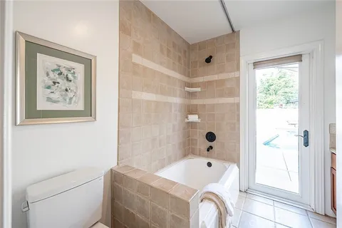 a bathroom with a bathtub and shower