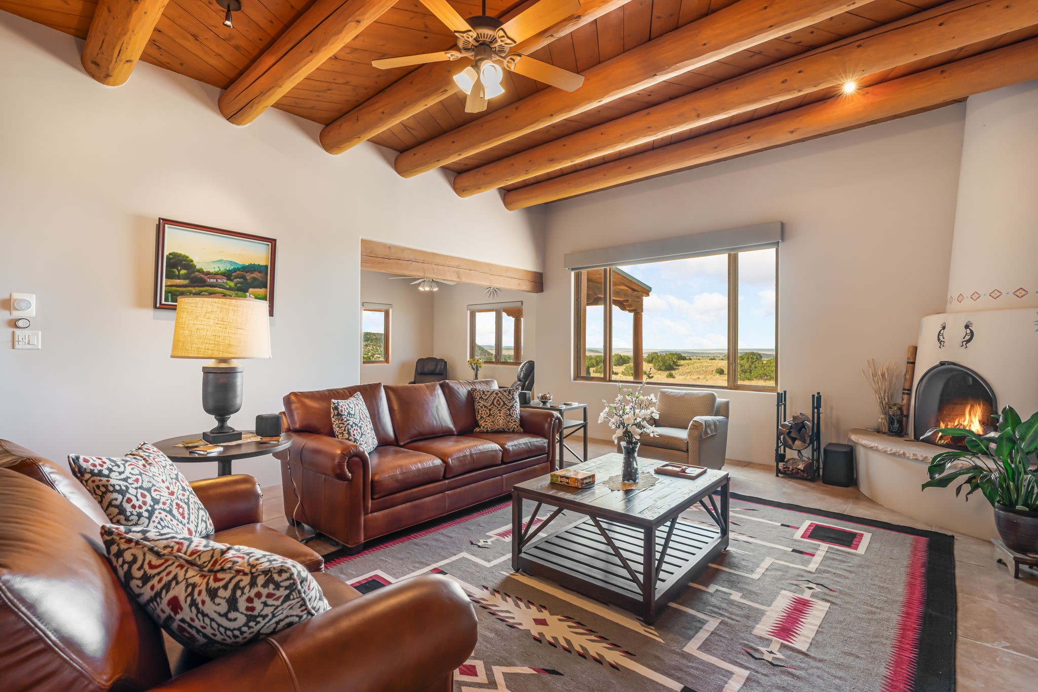 Viga ceilings and kiva fireplace in living room