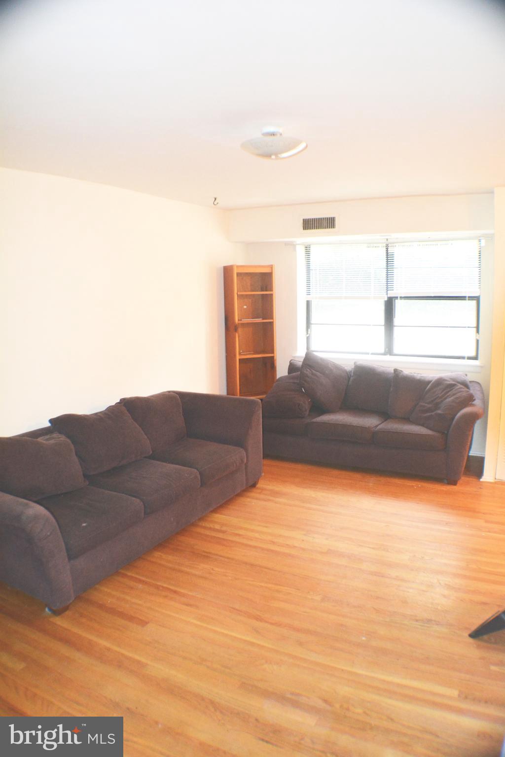 3413 Cresson Street, Unit 2 Philadelphia, PA 19129 - Photo 3 of 14 a living room with a couch and a dresser