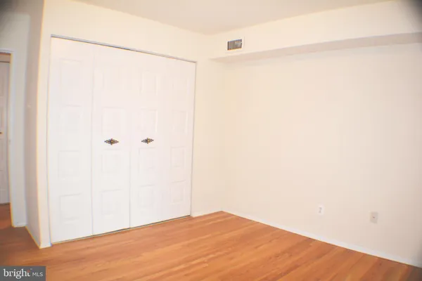 a view of a small space with wooden floor