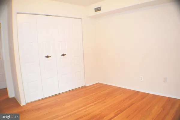 a view of a small space with wooden floor