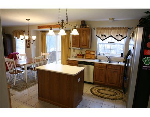 133 Lori Road Gibsonia, PA 15044 - Photo 6 of 18 Kitchen. WELL PLANNED KITCHEN WITH GENEROUS AMOUNT OF OAK CABINETS, CENTER ISLAND, PANTRY, STAINLESS STEEL APPLIANCES, AND NEUTRAL CERAMIC FLOORING.