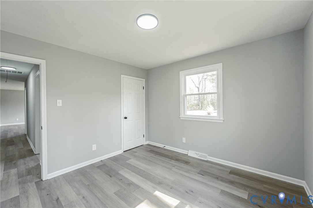 15412 Exter Mill Road Chesterfield, VA 23838 - Photo 45 of 66 Unfurnished bedroom featuring attic access and lig