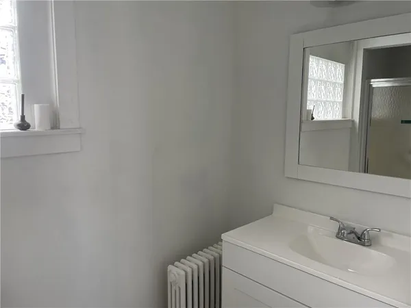 a bathroom with a sink and toilet