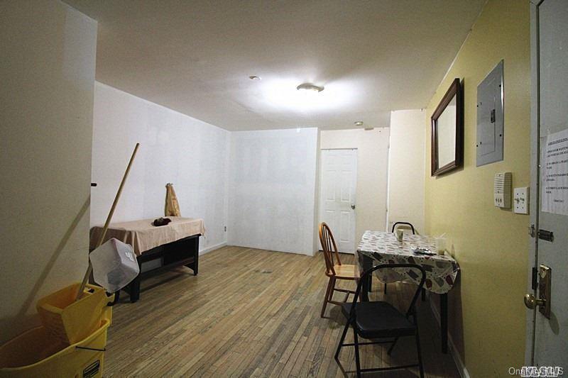 104-48 38th Avenue Queens, NY 11368 - Photo 3 of 9 a view of a dining room with furniture and wooden floor