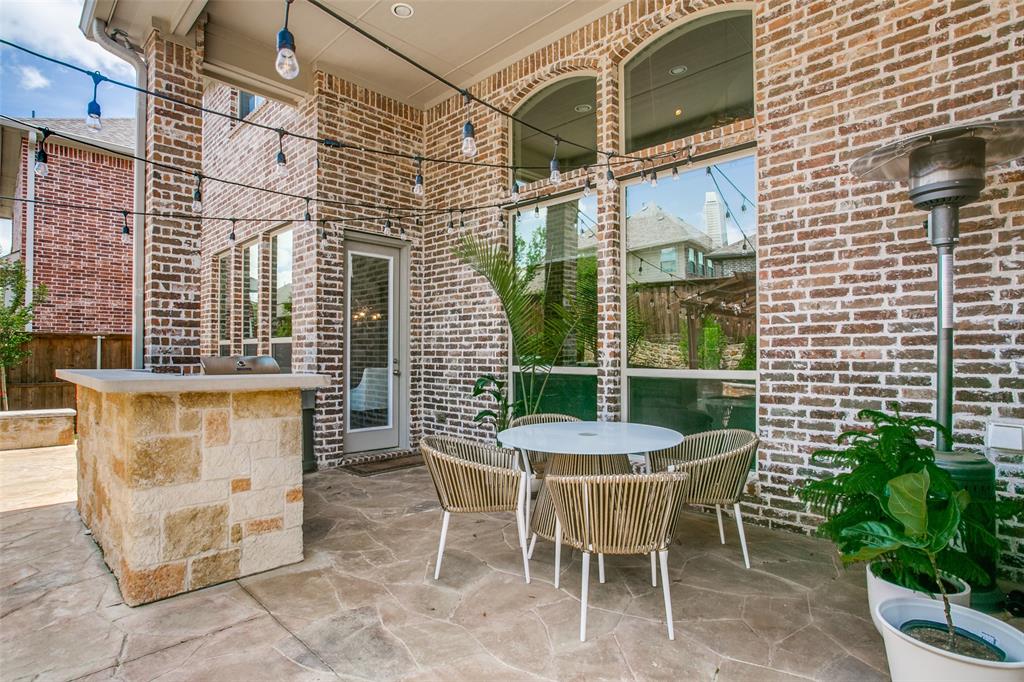 1518 Saddle Tree Road Frisco, TX 75036 - Photo 30 of 40 a view of a patio with a table and chairs and potted plants