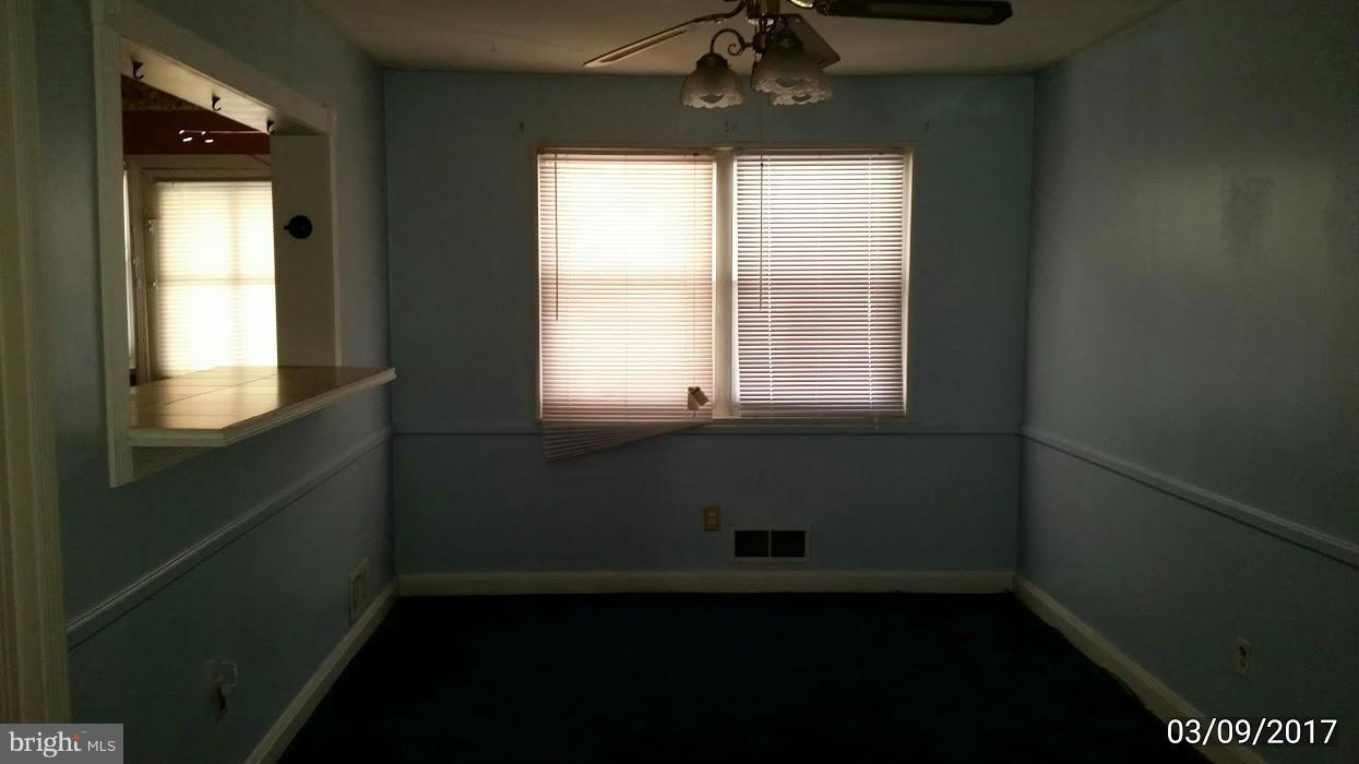 422 Scarsdale Road Baltimore, MD 21224 - Photo 6 of 7 a view of an empty room with a window