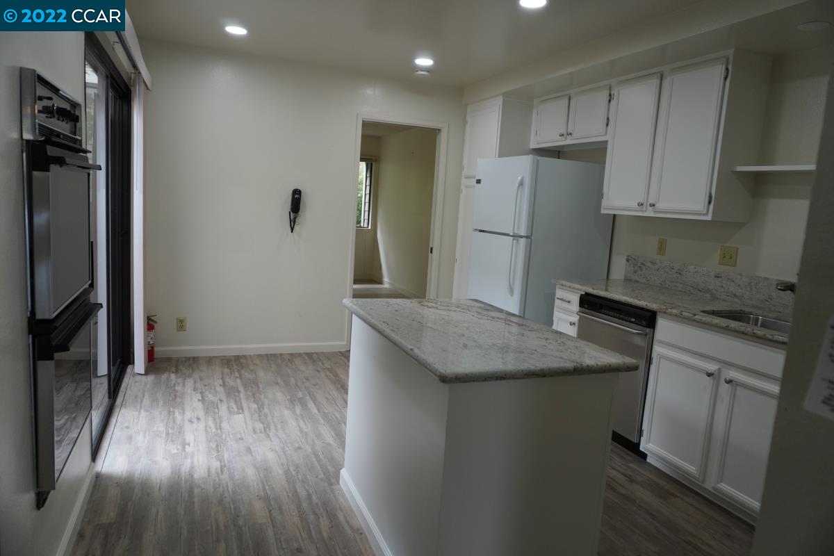 541 Adirondack Way Walnut Creek, CA 94598 - Photo 11 of 16 a kitchen with stainless steel appliances granite countertop a refrigerator and a stove