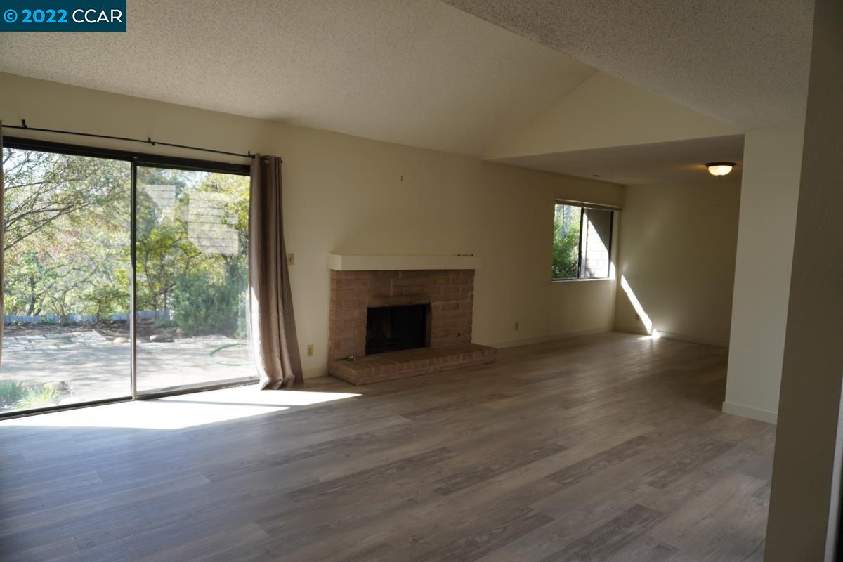 541 Adirondack Way Walnut Creek, CA 94598 - Photo 3 of 16 a view of empty room with wooden floor and fireplace