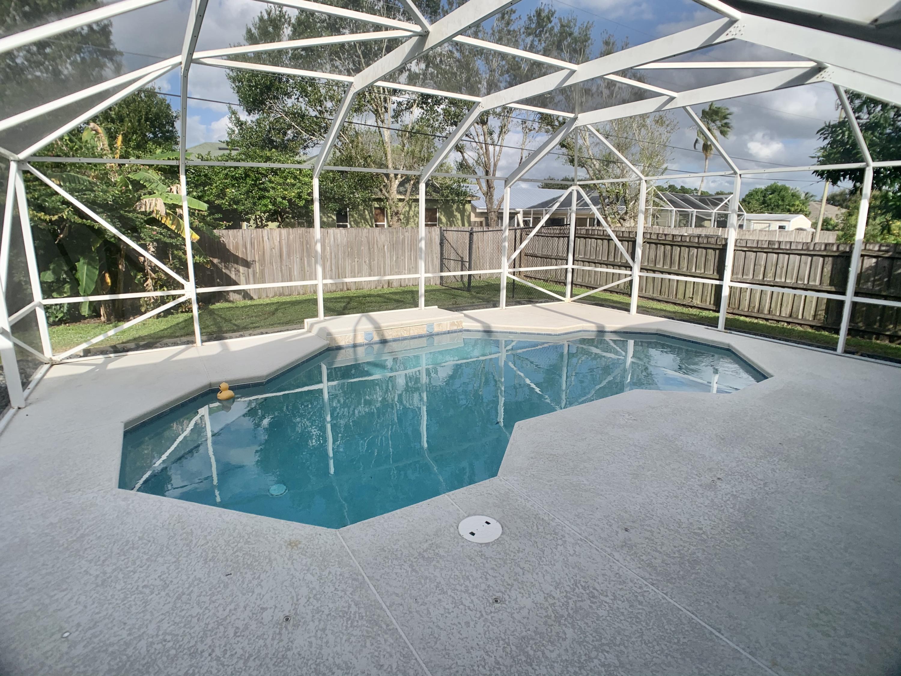 611 Southwest Aster Road Port St. Lucie, FL 34953 - Photo 32 of 40 2958E7E7-A366-40FD-BAFD-11AE411320D8_1_2