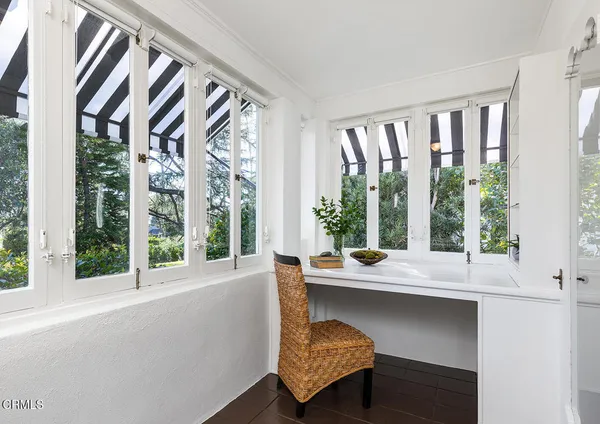 a living room with a large window and table