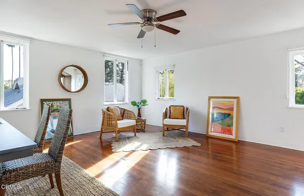 a living room with furniture a fireplace and a window
