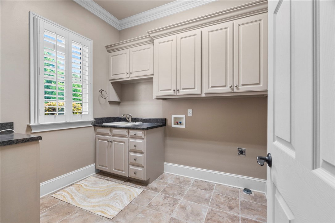 114 Willowbend Drive Anderson, SC 29621 - Photo 32 of 50 This functional space features elegant cabinetry and durable flooring, ensuring everyday tasks are handled with ease.