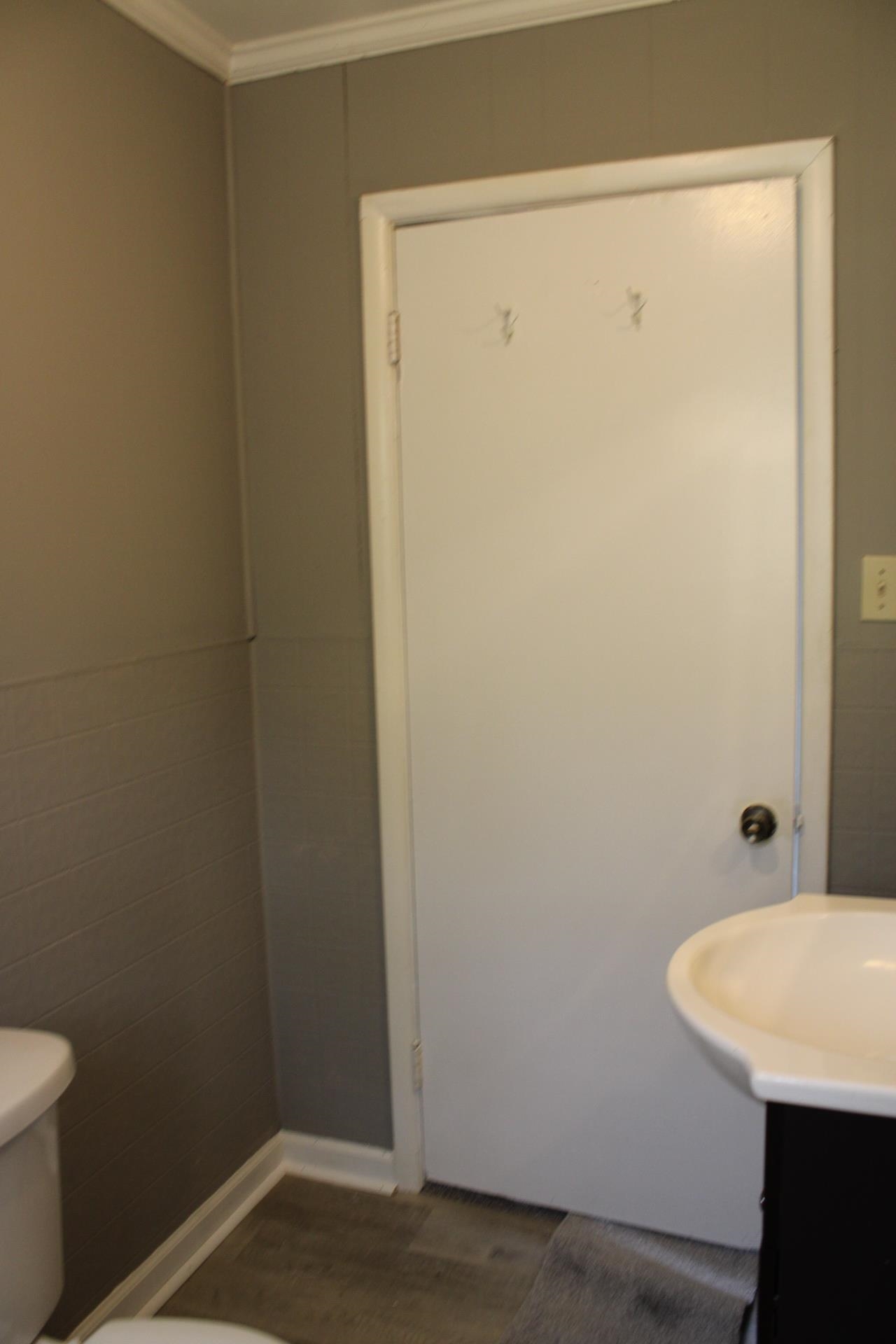 920 American Way Ripley, TN 38063 - Photo 17 of 18 a bathroom with a sink and a toilet
