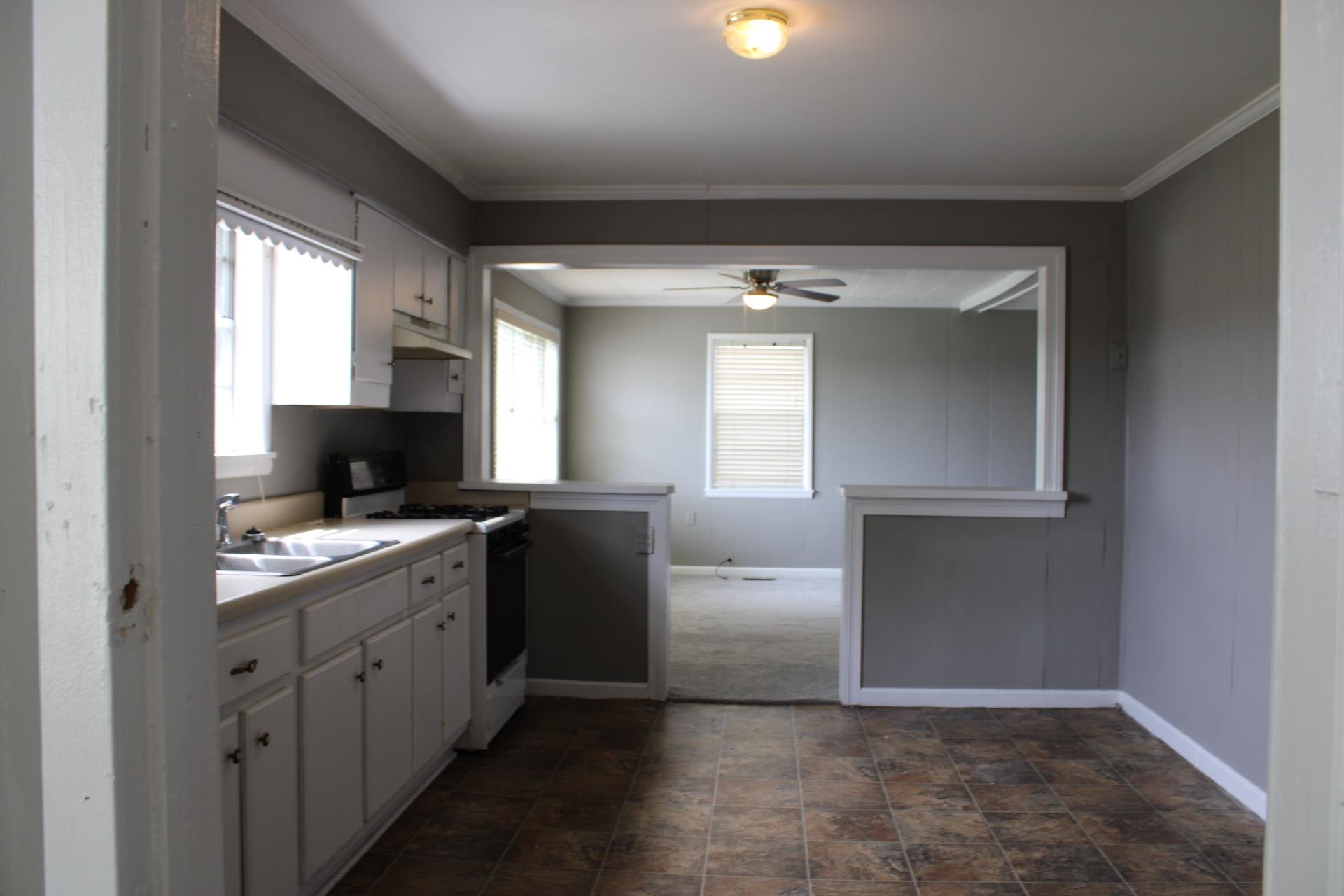 920 American Way Ripley, TN 38063 - Photo 9 of 18 a view of a kitchen with a sink cabinet and a window