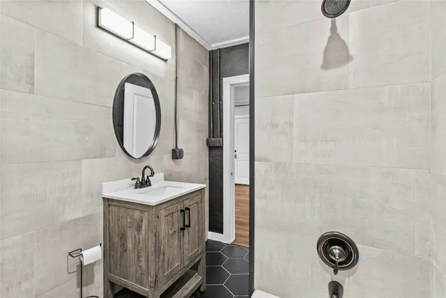 a bathroom with a sink and a mirror