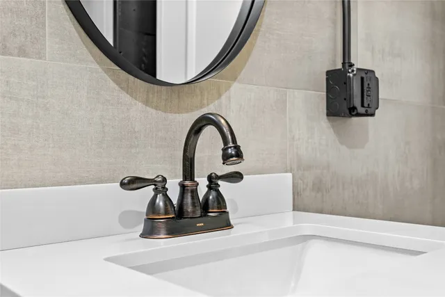 a bathroom with a sink and a mirror