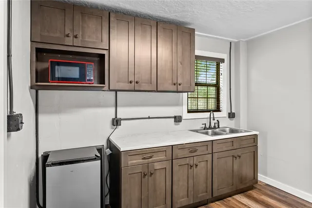 a kitchen with a sink and cabinets