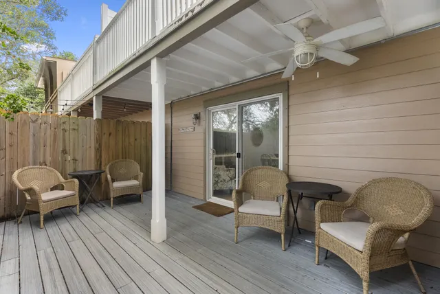 a balcony with furniture and wooden floor