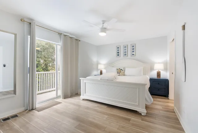 a view of bedroom with furniture and wooden floor