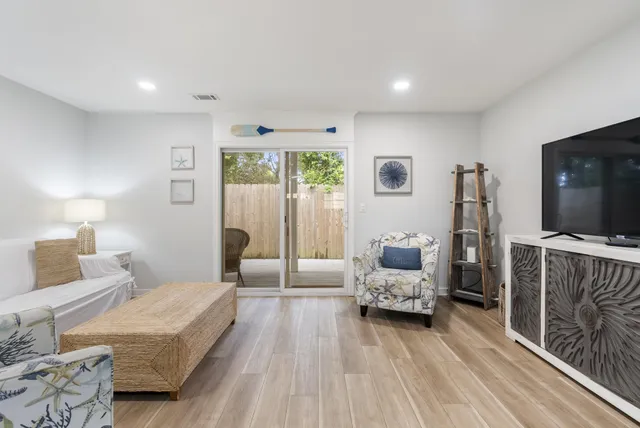 a bedroom with furniture and a flat screen tv