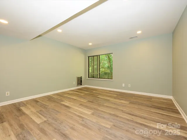 a view of front door with yard from balcony