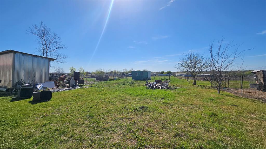 8736 Johns Road Alvarado, TX 76009 - Photo 28 of 32 a view of a backyard with sitting area