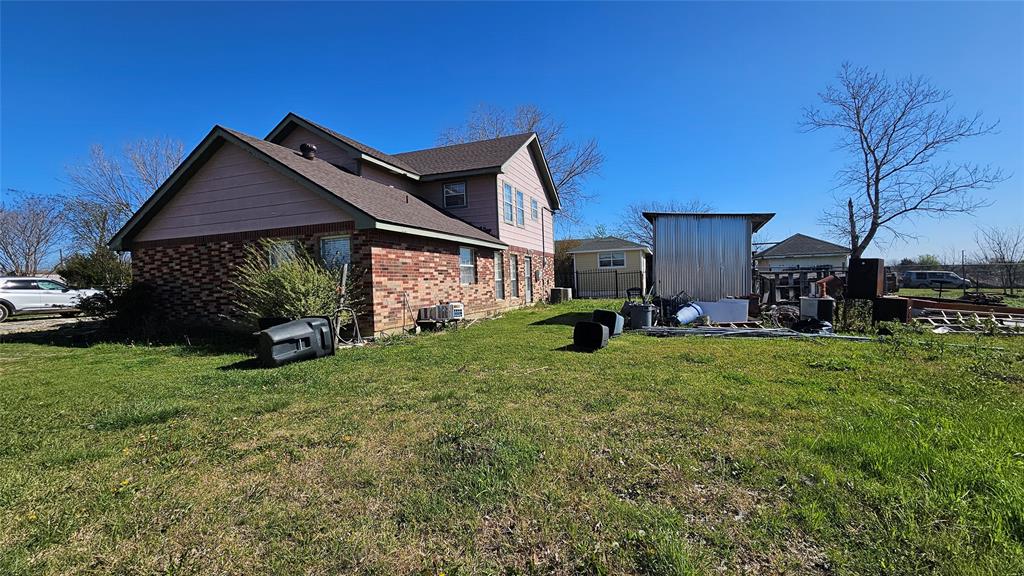 8736 Johns Road Alvarado, TX 76009 - Photo 29 of 32 a view of backyard of house with outdoor seating and green space