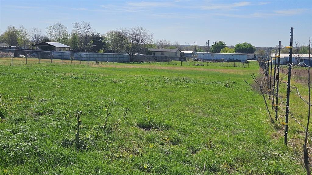 8736 Johns Road Alvarado, TX 76009 - Photo 31 of 32 a view of a golf course with a lake view