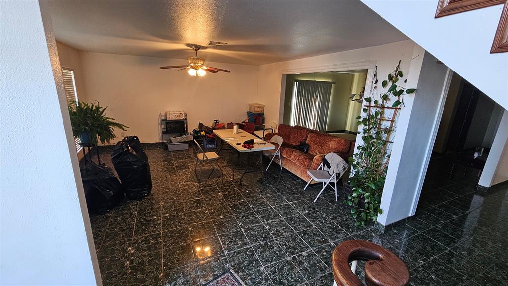 8736 Johns Road Alvarado, TX 76009 - Photo 4 of 32 a living room with furniture and a flat screen tv