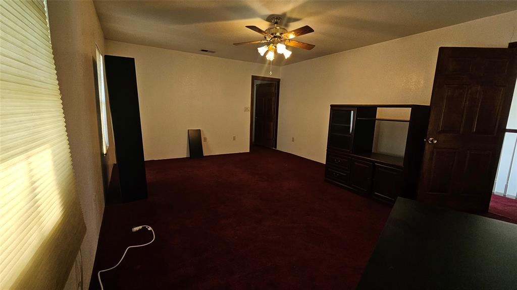 8736 Johns Road Alvarado, TX 76009 - Photo 10 of 32 wooden floor in an empty room with a window