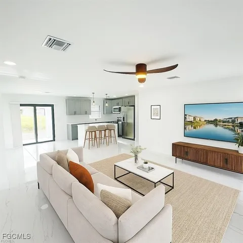 a living room with furniture and a window