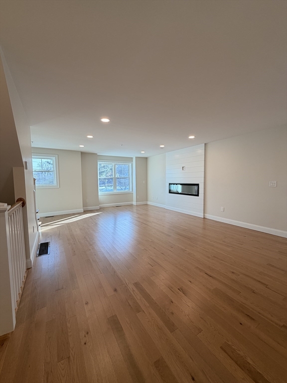 9 Acton Road, Unit 8 Chelmsford, MA 01824 - Photo 3 of 12 a view of a kitchen with a sink and a refrigerator
