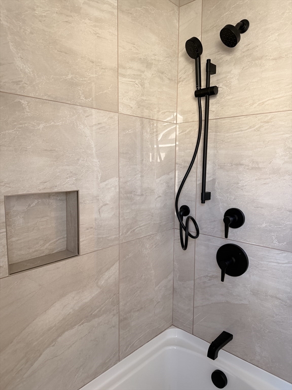 9 Acton Road, Unit 8 Chelmsford, MA 01824 - Photo 8 of 12 a bathroom with a shower