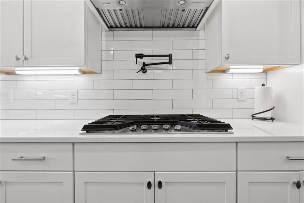 3528 North Bogan Road Buford, GA 30519 - Photo 13 of 79 a white stove top oven sitting inside of a kitchen
